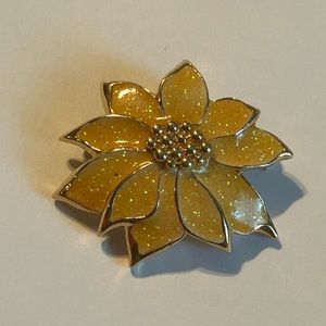 This beautiful brooch is from Avon's 1987 "White Christmas" collection.